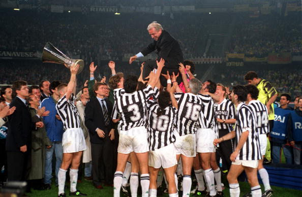 Football. UEFA Cup Final, Second Leg. Turin, Italy. 19th May 1993. Juventus 3 v Borussia Dortmund 0 (Juventus win 6-1 on aggregate). The Juventus team and officials lift coach Giovanni Trapattoni onto their shoulders as they celebrate with the trophy.